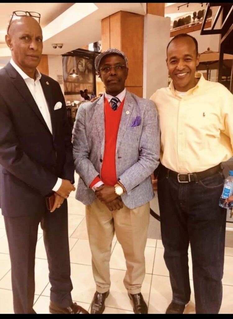 Three community members standing together in a shopping centre